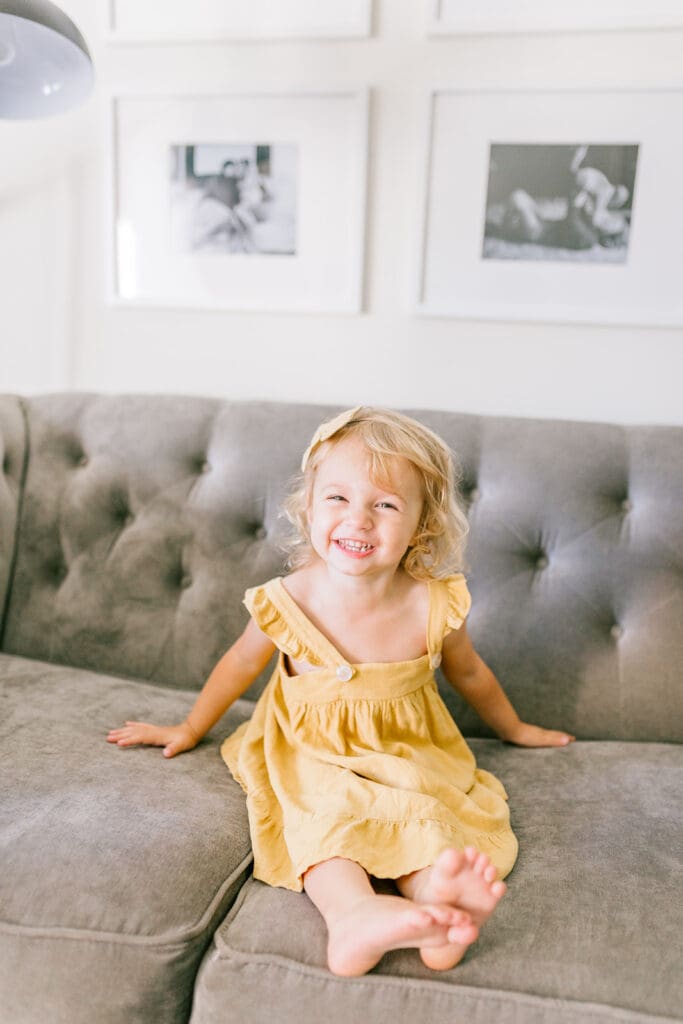 Lifestyle family photographer in Richmond documenting the Allred family reading, playing, dancing and snuggling in coordinated outfits.