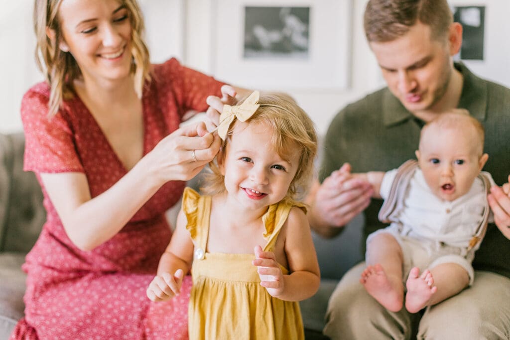 Lifestyle family photographer in Richmond documenting the Allred family reading, playing, dancing and snuggling in coordinated outfits.