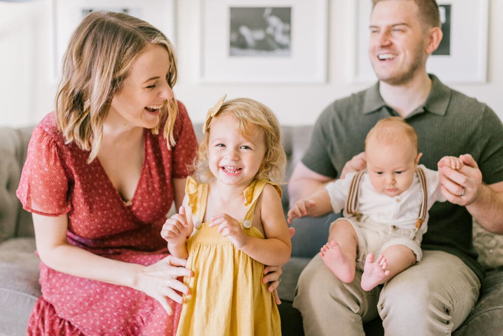 Lifestyle family photographer in Richmond documenting the Allred family reading, playing, dancing and snuggling in coordinated outfits.