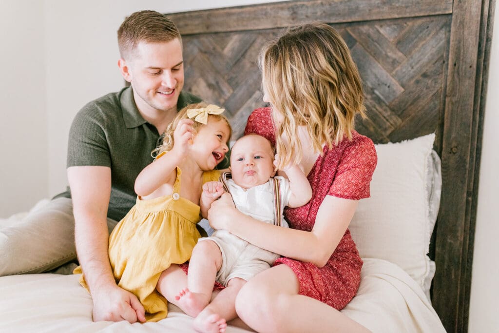 Lifestyle family photographer in Richmond documenting the Allred family reading, playing, dancing and snuggling in coordinated outfits.