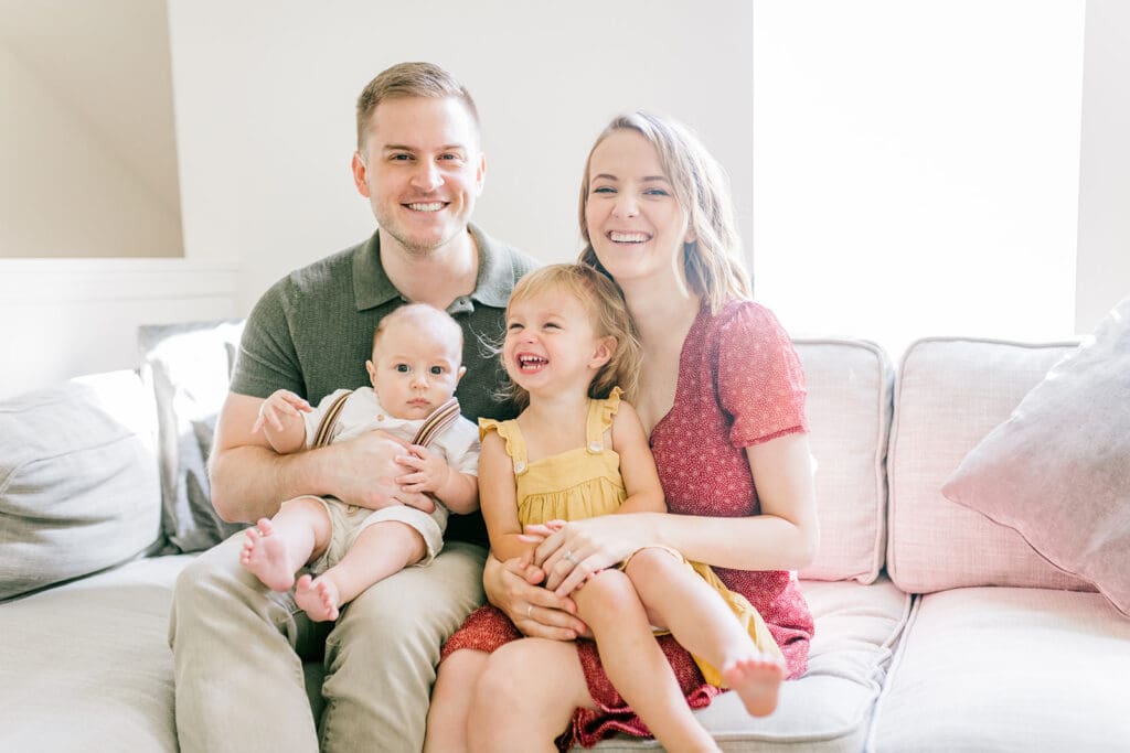 Lifestyle family photographer in Richmond documenting the Allred family reading, playing, dancing and snuggling in coordinated outfits.