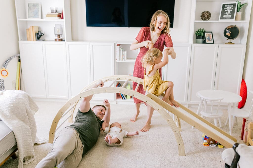 Lifestyle family photographer in Richmond documenting the Allred family reading, playing, dancing and snuggling in coordinated outfits.