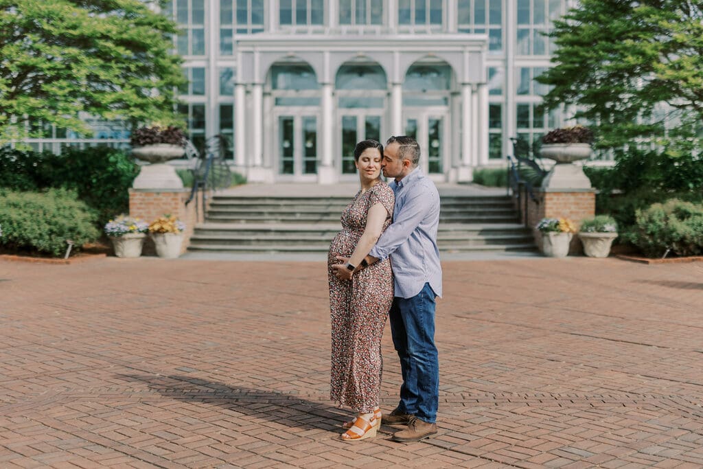 Lewis Ginter maternity photography session featuring the Mertz family surrounded by spring blooms in the botanical gardens.