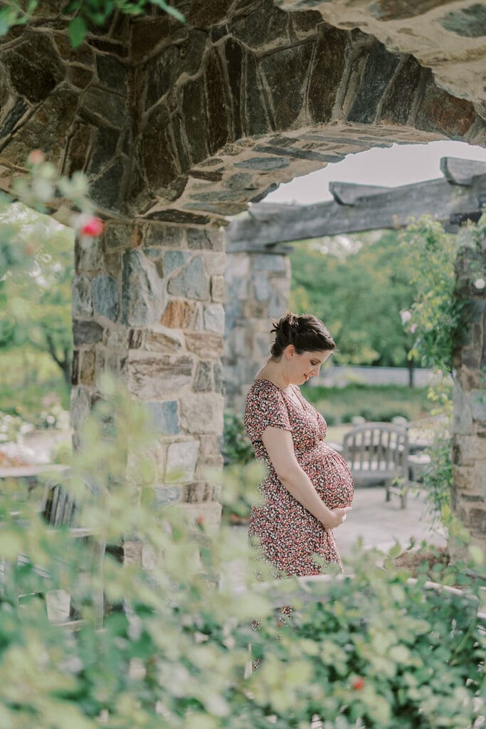 Lewis Ginter maternity photography session featuring the Mertz family surrounded by spring blooms in the botanical gardens.