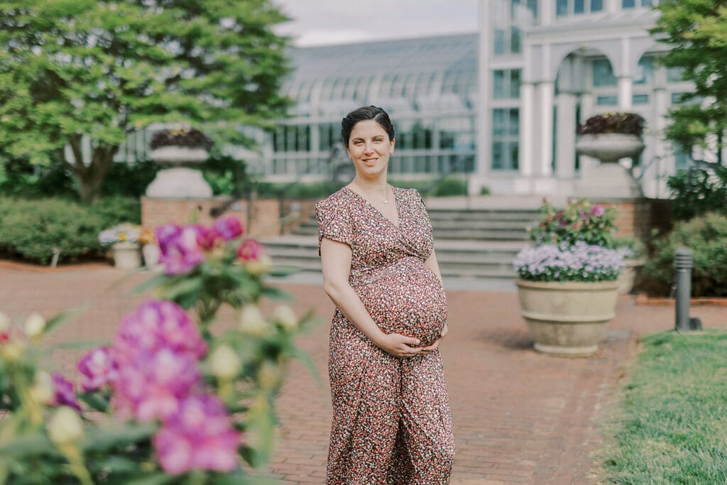 Lewis Ginter maternity photography session featuring the Mertz family surrounded by spring blooms in the botanical gardens.