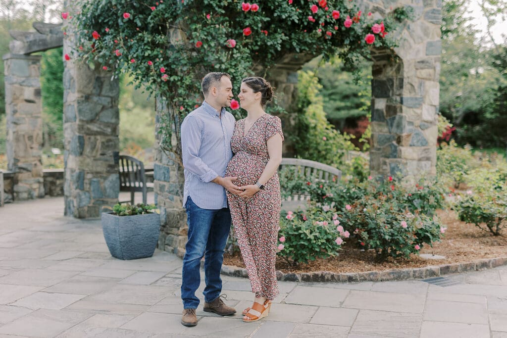 Lewis Ginter maternity photography session featuring the Mertz family surrounded by spring blooms in the botanical gardens.