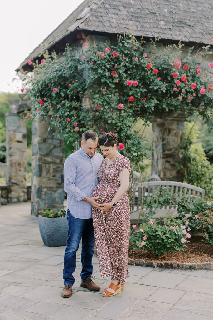 Lewis Ginter maternity photography session featuring the Mertz family surrounded by spring blooms in the botanical gardens.