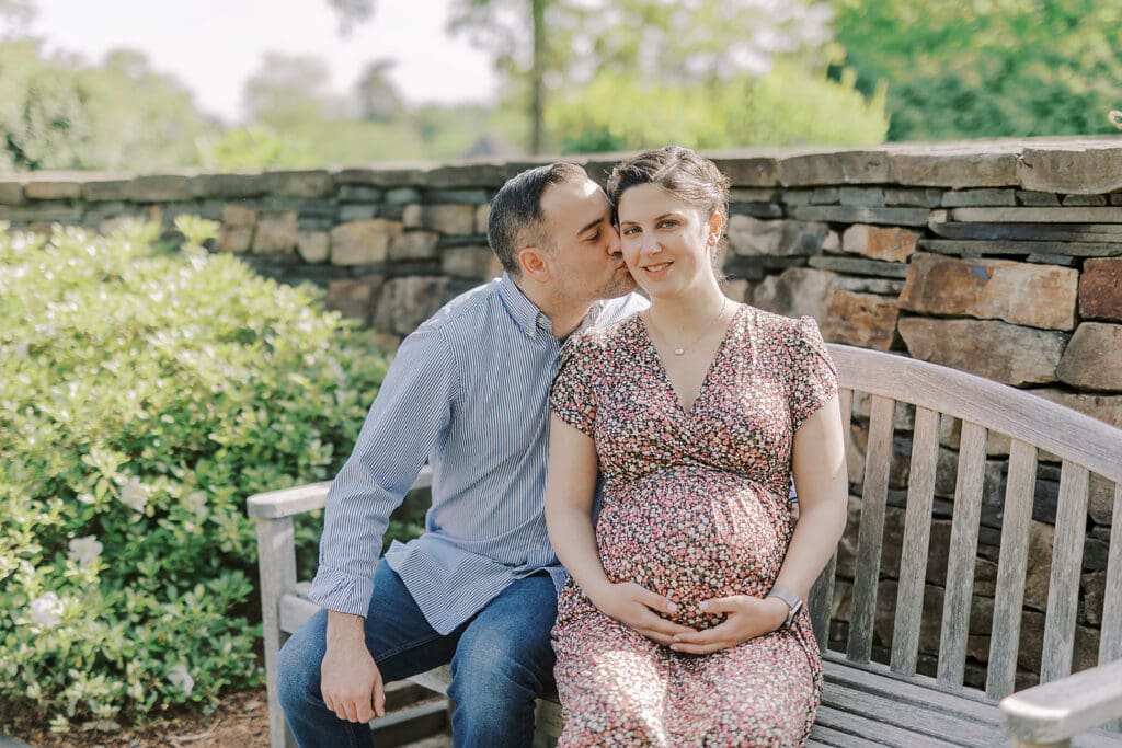 Lewis Ginter maternity photography session featuring the Mertz family surrounded by spring blooms in the botanical gardens.