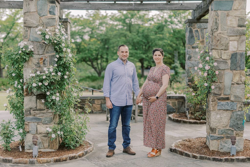 Lewis Ginter maternity photography session featuring the Mertz family surrounded by spring blooms in the botanical gardens.