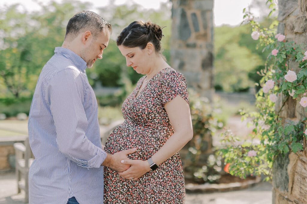 Lewis Ginter maternity photography session featuring the Mertz family surrounded by spring blooms in the botanical gardens.