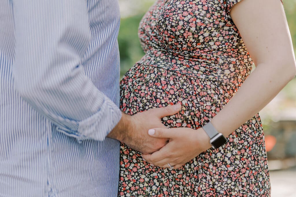 Lewis Ginter maternity photography session featuring the Mertz family surrounded by spring blooms in the botanical gardens.