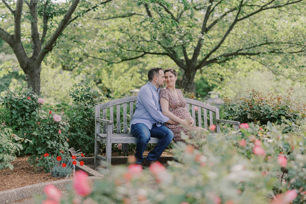 Lewis Ginter maternity photography session featuring the Mertz family surrounded by spring blooms in the botanical gardens.