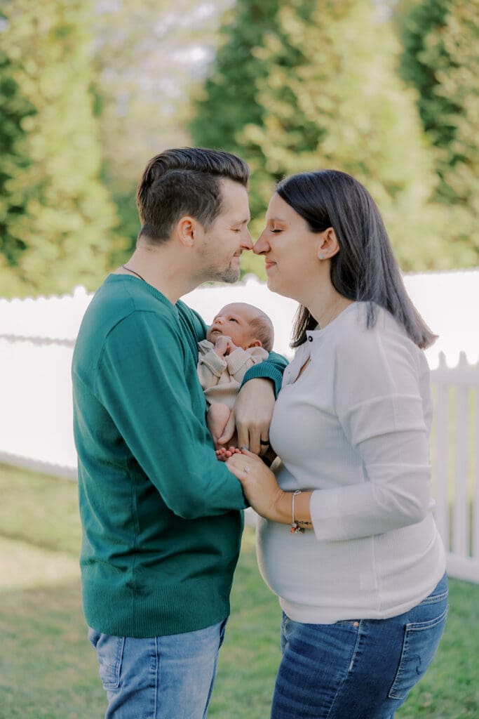 Lifestyle newborn photography in Richmond session showing the Barnes family with baby Lincoln in their home and backyard.