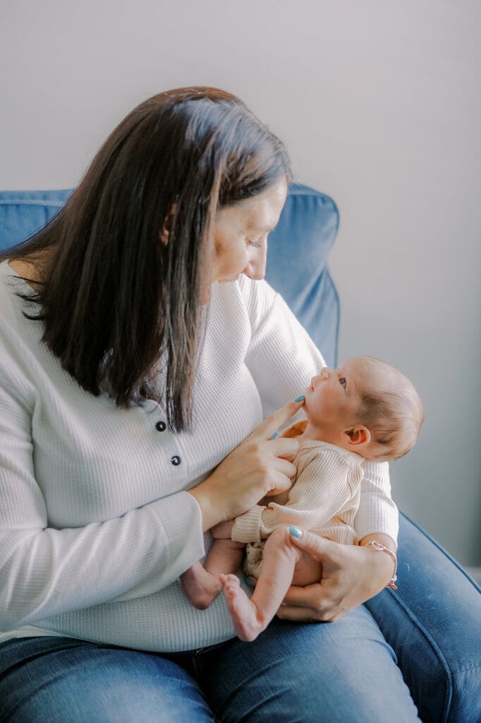 Lifestyle newborn photography in Richmond session showing the Barnes family with baby Lincoln in their home and backyard.