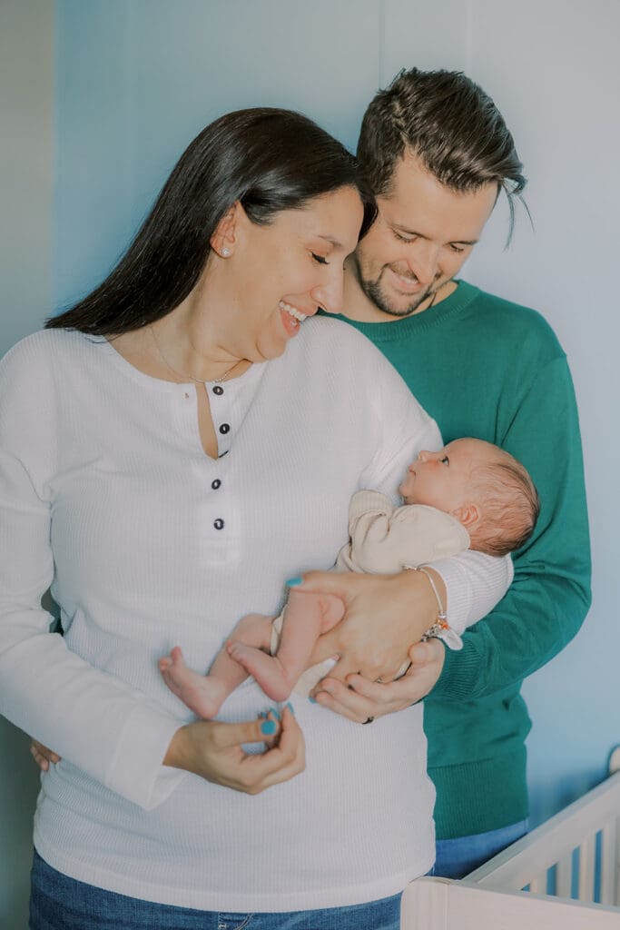 Lifestyle newborn photography in Richmond session showing the Barnes family with baby Lincoln in their home and backyard.