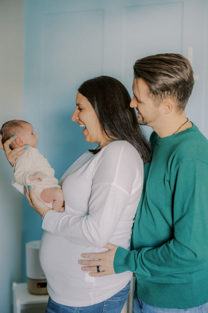 Lifestyle newborn photography in Richmond session showing the Barnes family with baby Lincoln in their home and backyard.