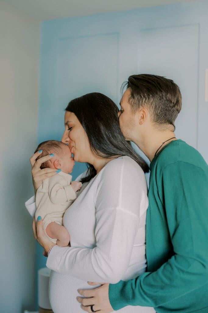 Lifestyle newborn photography in Richmond session showing the Barnes family with baby Lincoln in their home and backyard.