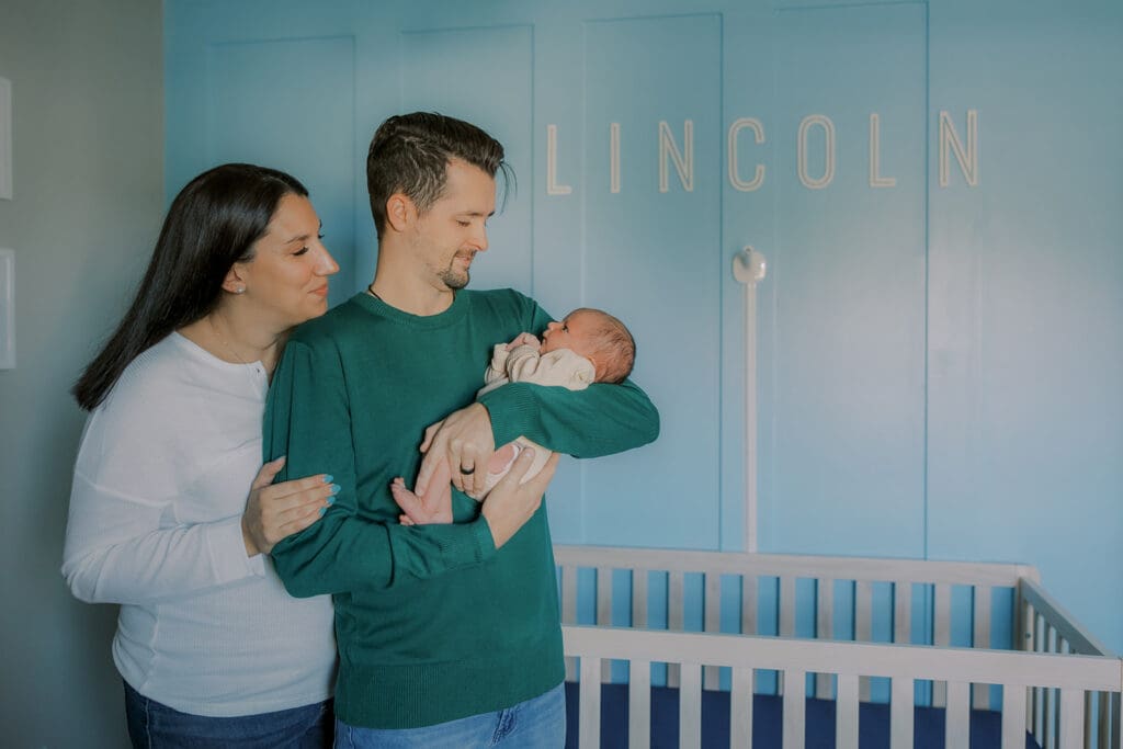 Lifestyle newborn photography in Richmond session showing the Barnes family with baby Lincoln in their home and backyard.