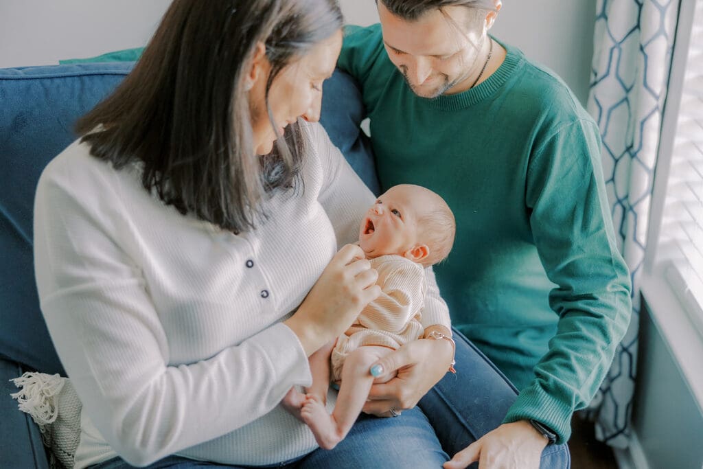 Lifestyle newborn photography in Richmond session showing the Barnes family with baby Lincoln in their home and backyard.