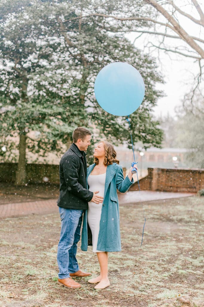 A couple waits eagerly to learn the gender of their baby during their Williamsburg gender reveal.