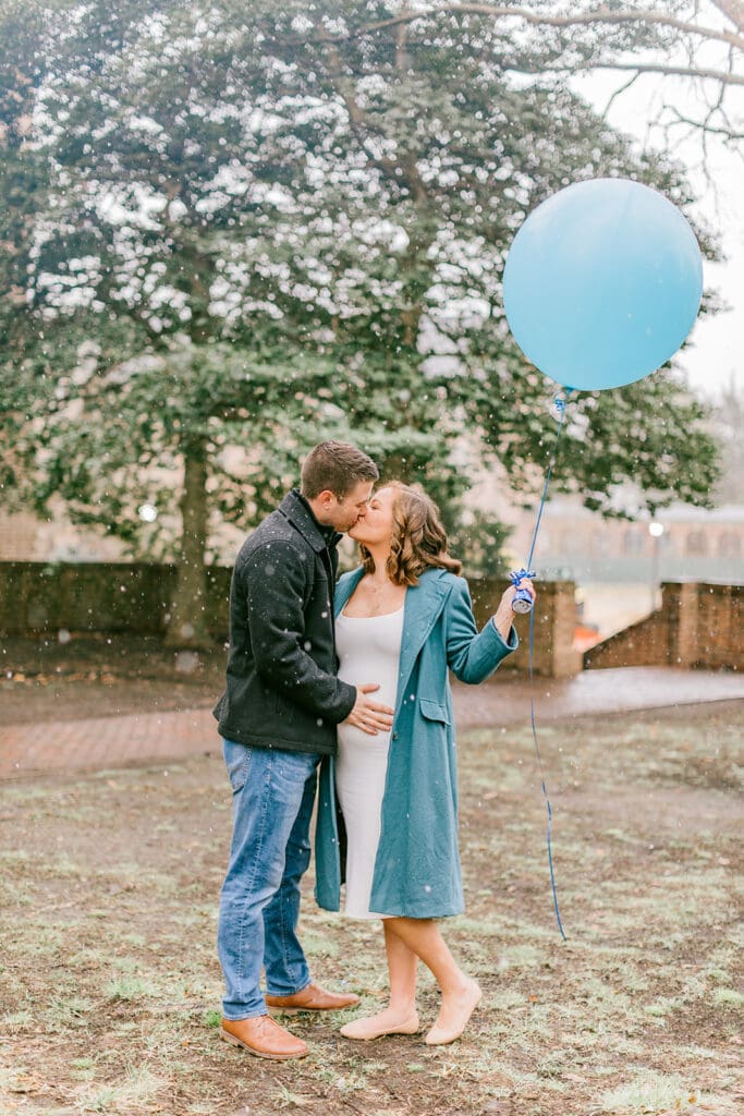 A couple waits eagerly to learn the gender of their baby during their Williamsburg gender reveal.