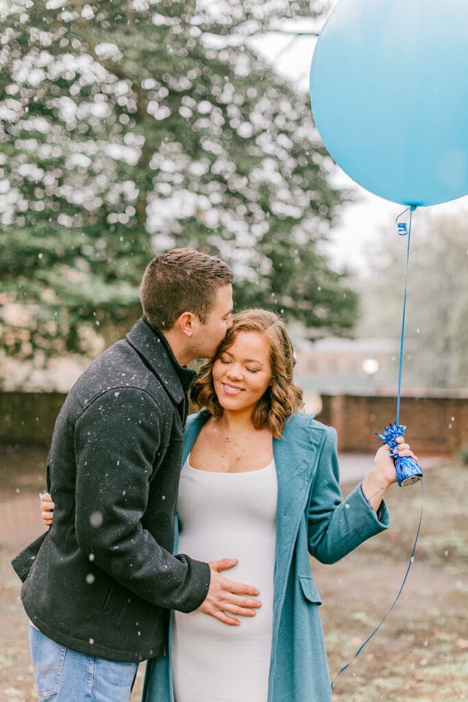 A couple waits eagerly to learn the gender of their baby during their Williamsburg gender reveal.