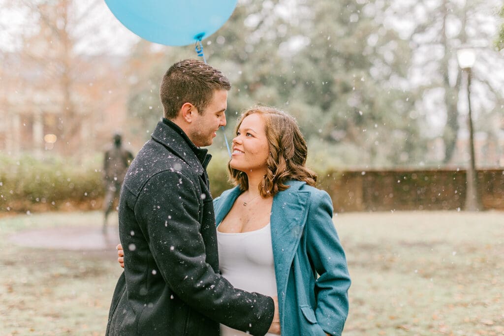 A couple waits eagerly to learn the gender of their baby during their Williamsburg gender reveal.