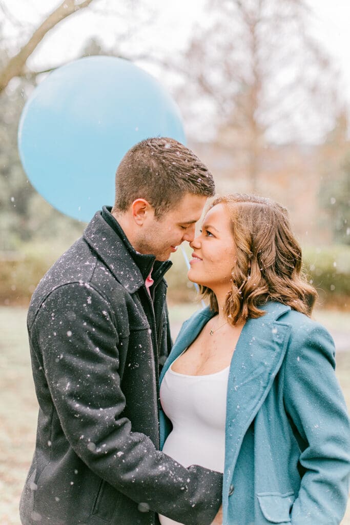 A couple waits eagerly to learn the gender of their baby during their Williamsburg gender reveal.