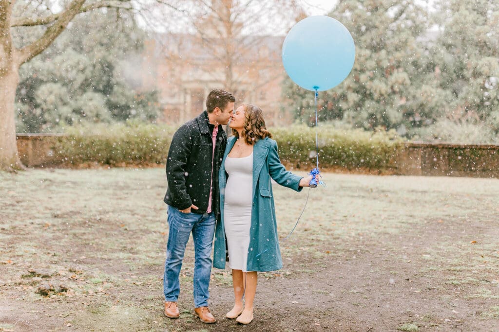 A couple waits eagerly to learn the gender of their baby during their Williamsburg gender reveal.