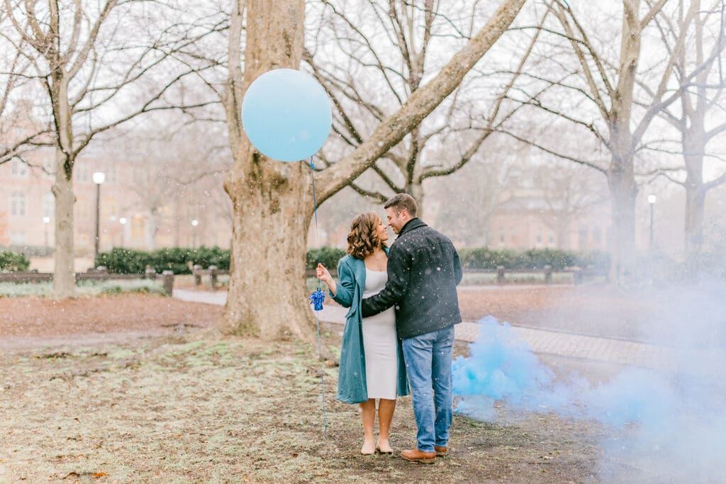 A couple waits eagerly to learn the gender of their baby during their Williamsburg gender reveal.