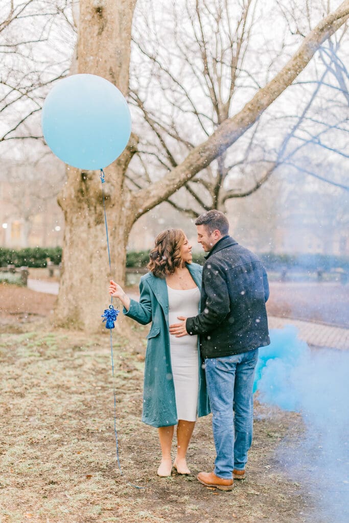 A couple waits eagerly to learn the gender of their baby during their Williamsburg gender reveal.