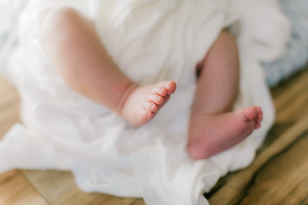 Newborn session photo of baby's toes.