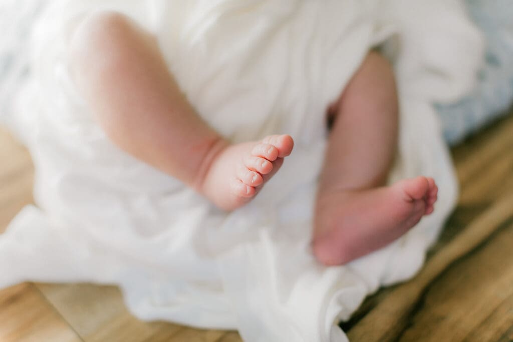 Hampton Roads newborn photography session featuring Baby Caeden in simple white setups with crate and bucket props.