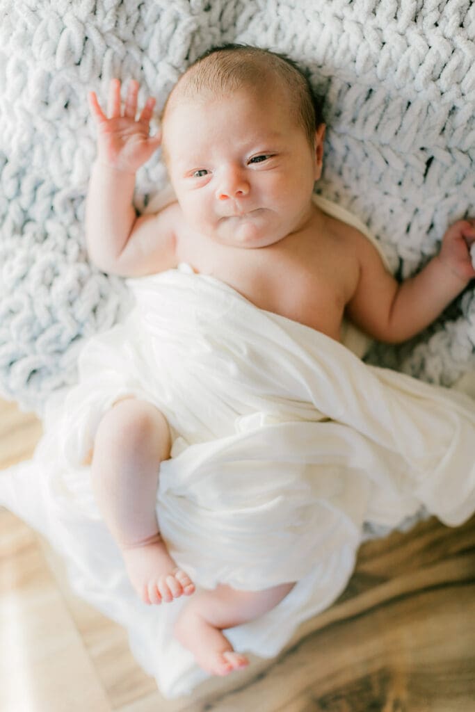 Hampton Roads newborn photography session featuring Baby Caeden in simple white setups with crate and bucket props.