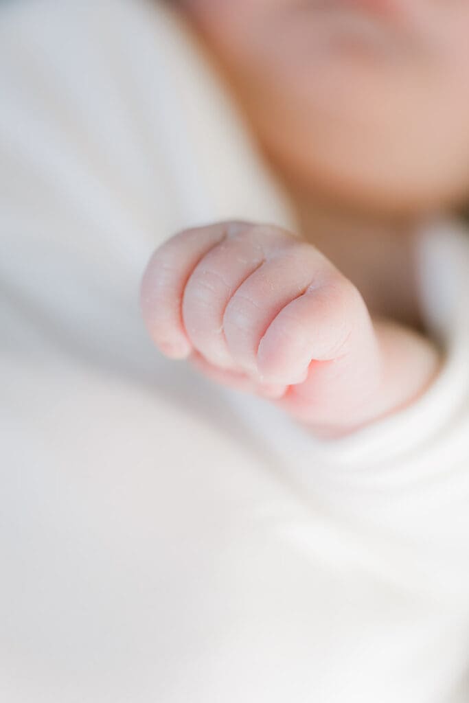 Hampton Roads newborn photography session featuring Baby Caeden in simple white setups with crate and bucket props.