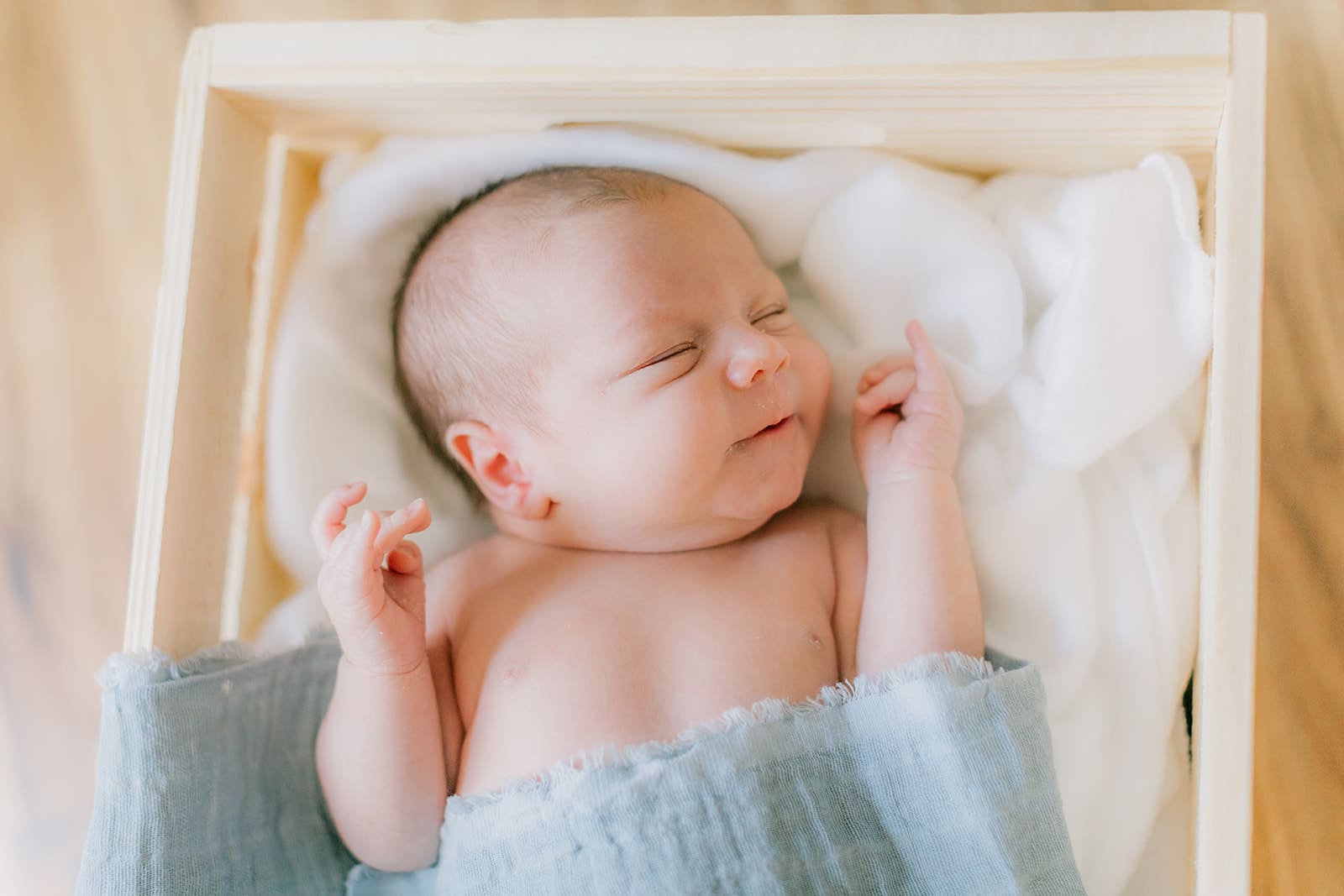 Hampton Roads newborn photography session featuring Baby Caeden in simple white setups with crate and bucket props.