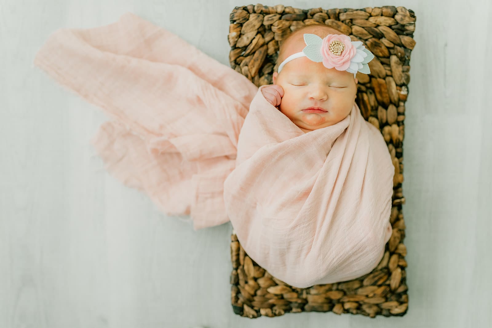 Baby Ember poses during her in-home newborn photography session.