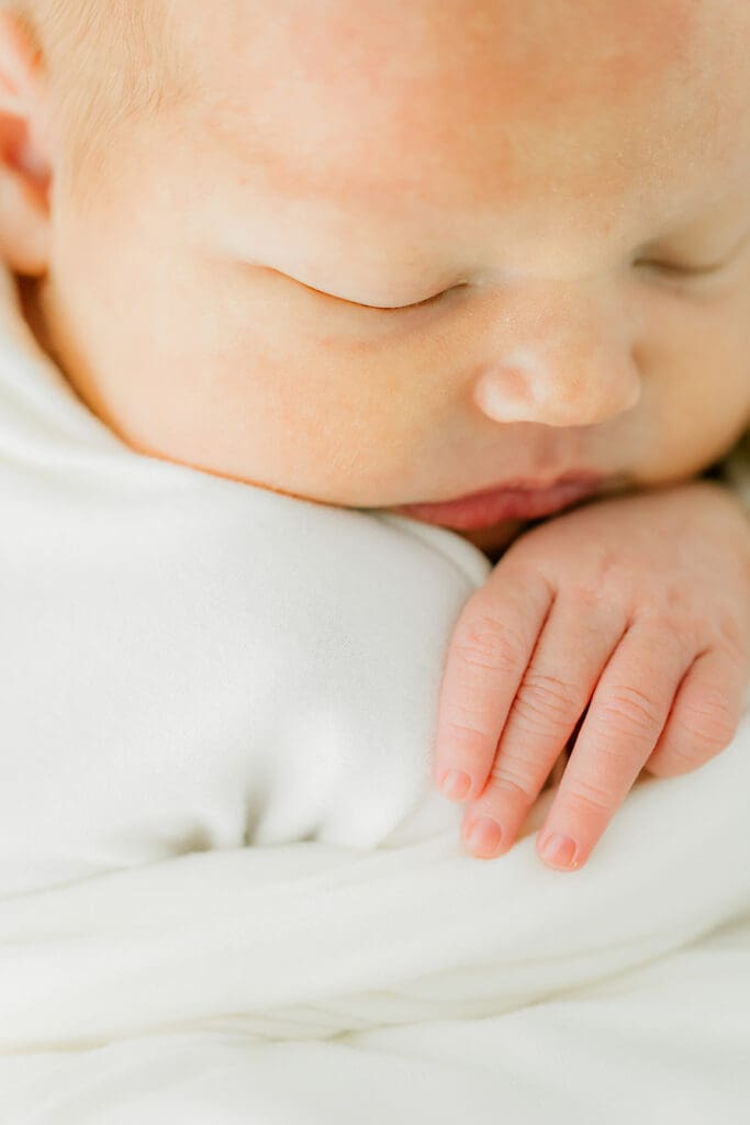 Baby Ember sleeps during her in-home newborn photography session.