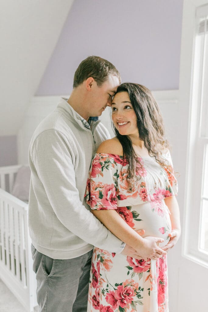 March maternity session in Williamsburg featuring the Sabo family in their cozy home and baby's nursery.