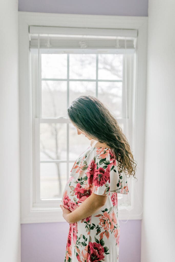 March maternity session in Williamsburg featuring the Sabo family in their cozy home and baby's nursery.