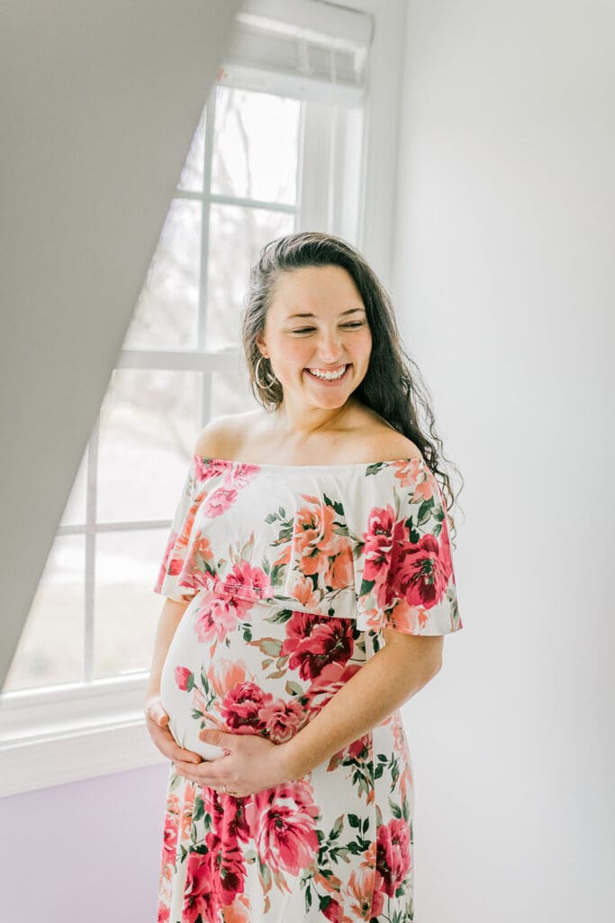 March maternity session in Williamsburg featuring the Sabo family in their cozy home and baby's nursery.