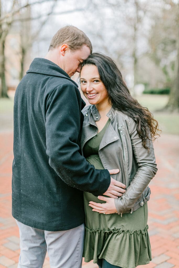 March maternity session in Williamsburg featuring the Sabo family in their cozy home and baby's nursery.