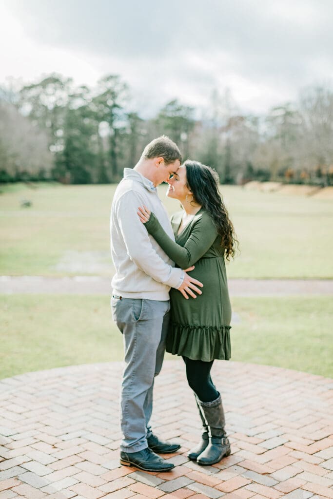 March maternity session in Williamsburg featuring the Sabo family in their cozy home and baby's nursery.