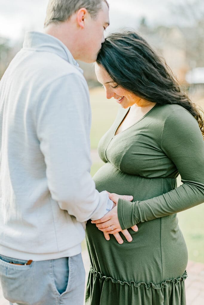 March maternity session in Williamsburg featuring the Sabo family in their cozy home and baby's nursery.