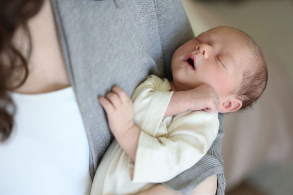 Richmond newborn photographer session featuring baby Cooper and his family in their sunlit Rockville home with their dog Riley