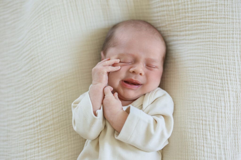 Richmond newborn photographer session featuring baby Cooper and his family in their sunlit Rockville home with their dog Riley