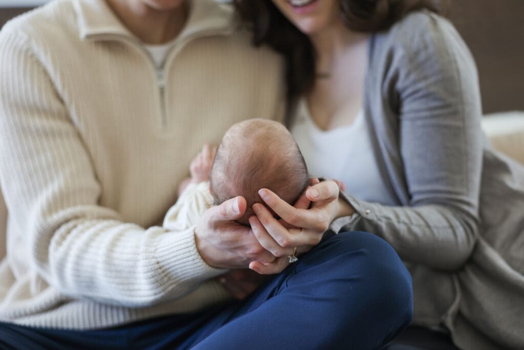 Richmond newborn photographer session featuring baby Cooper and his family in their sunlit Rockville home with their dog Riley