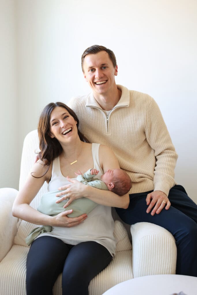 Richmond newborn photographer session featuring baby Cooper and his family in their sunlit Rockville home with their dog Riley