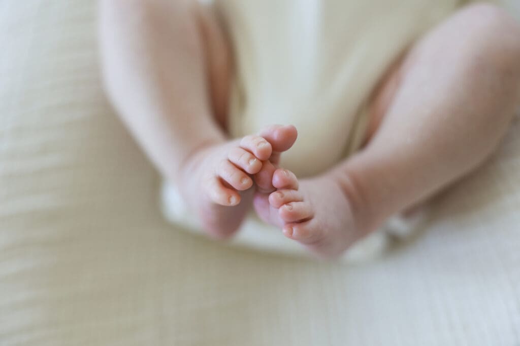 Richmond newborn photographer session featuring baby Cooper and his family in their sunlit Rockville home with their dog Riley