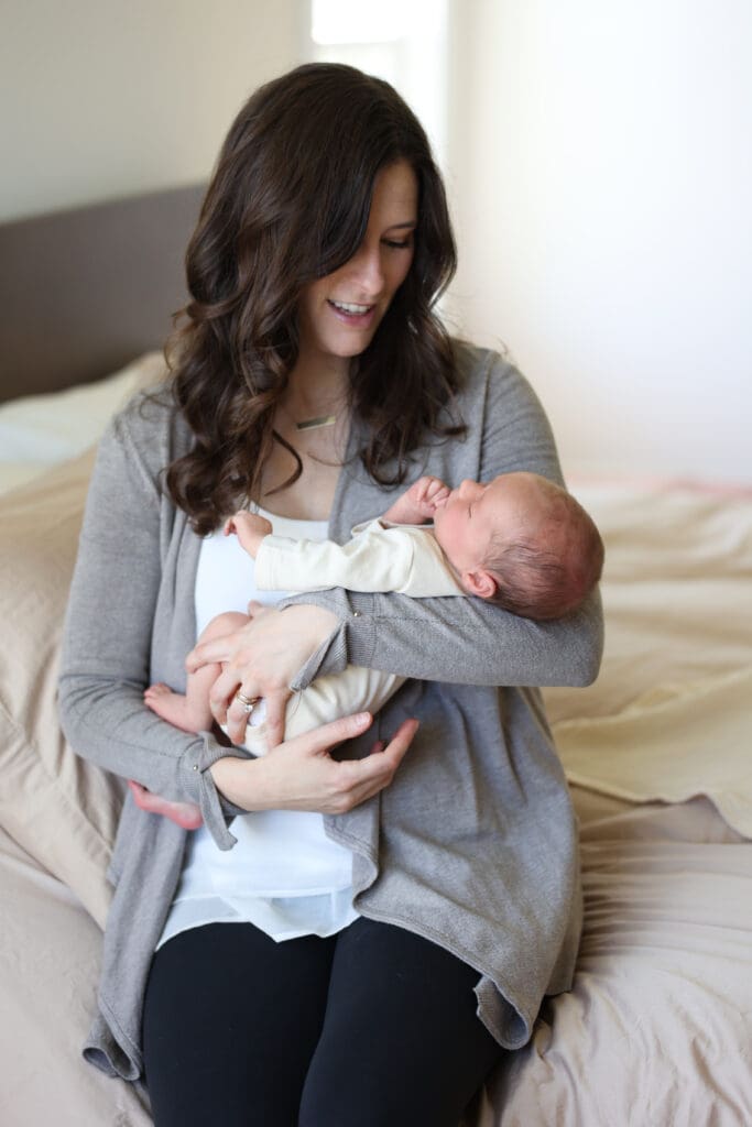 Richmond newborn photographer session featuring baby Cooper and his family in their sunlit Rockville home with their dog Riley
